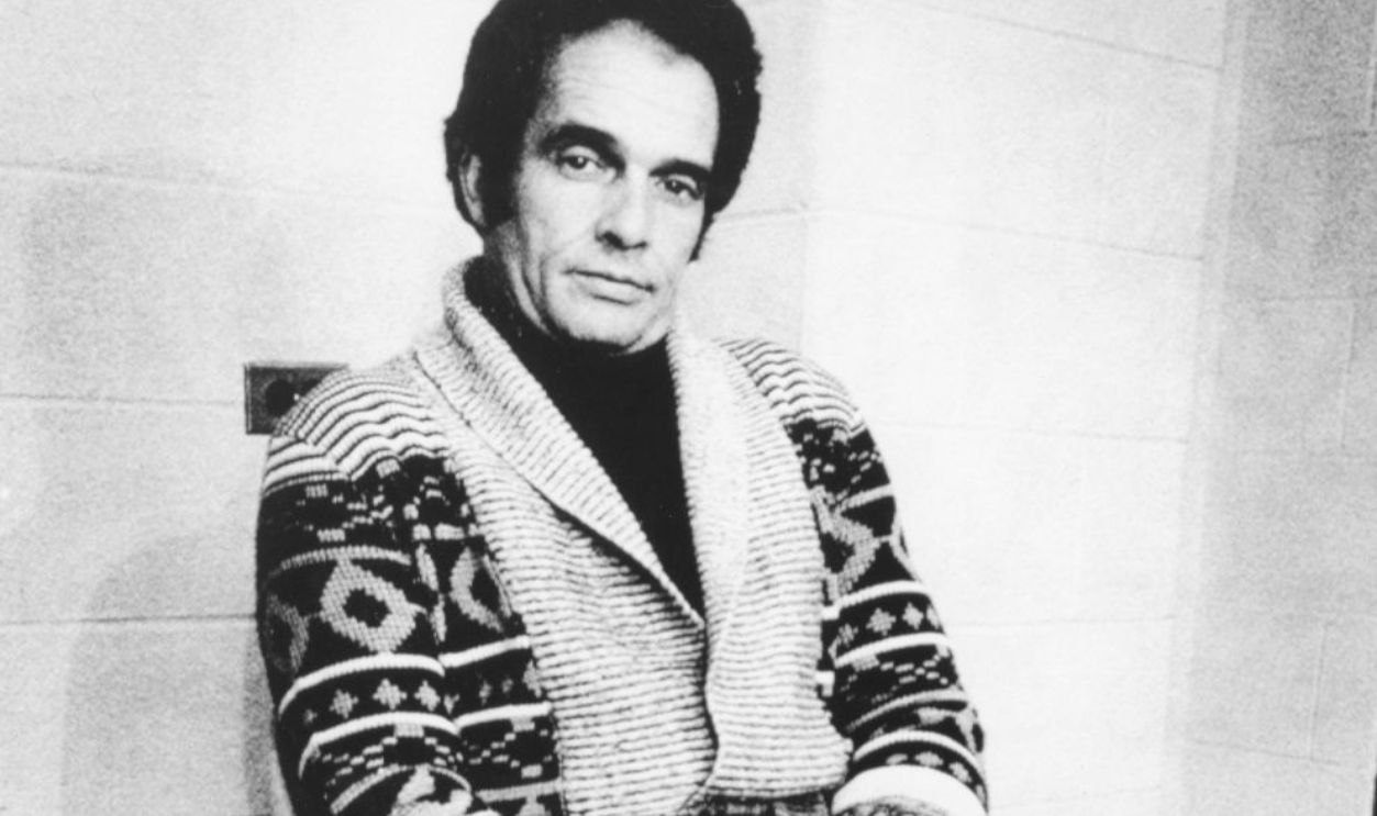 Merle Haggard sits in a chair backstage before going onstage for his new North American tour.