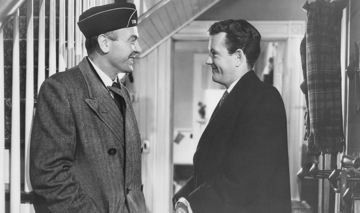 Getty Images - 136871974 - Unidentified man and Robert Walker smiling at each other in the hall in a scene from the film 'My Son John', 1952.