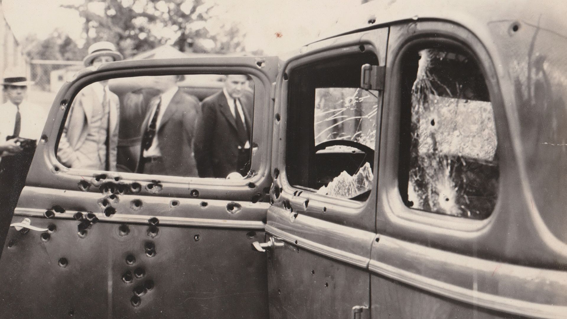 Bonny and Clydes car (1934 Ford Model 40B), riddled with bullet holes after the ambush. Picture taken by FBI investigators on May 23, 1934.