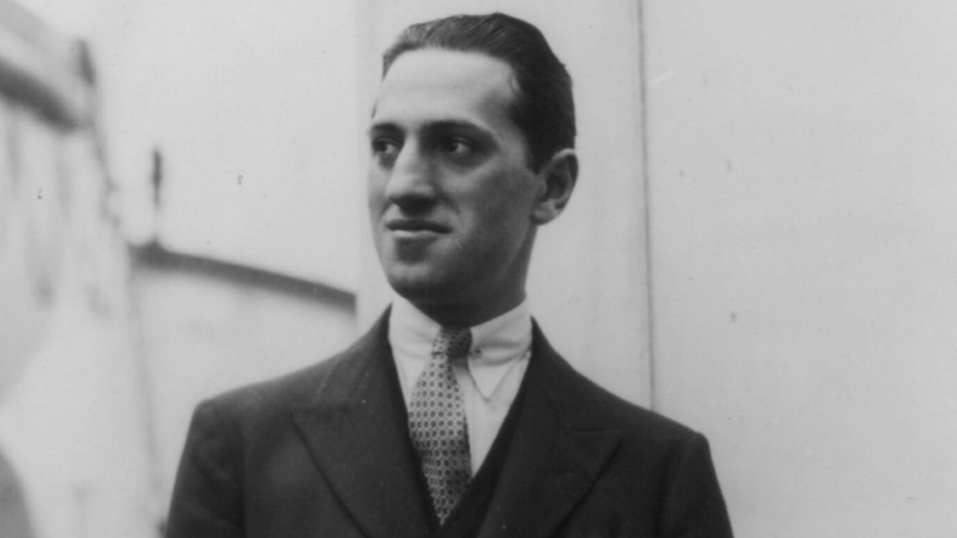 Title: George Gershwin, 1898-1937, half-length portrait, standing, facing left
Abstract/medium: 1 photographic print.