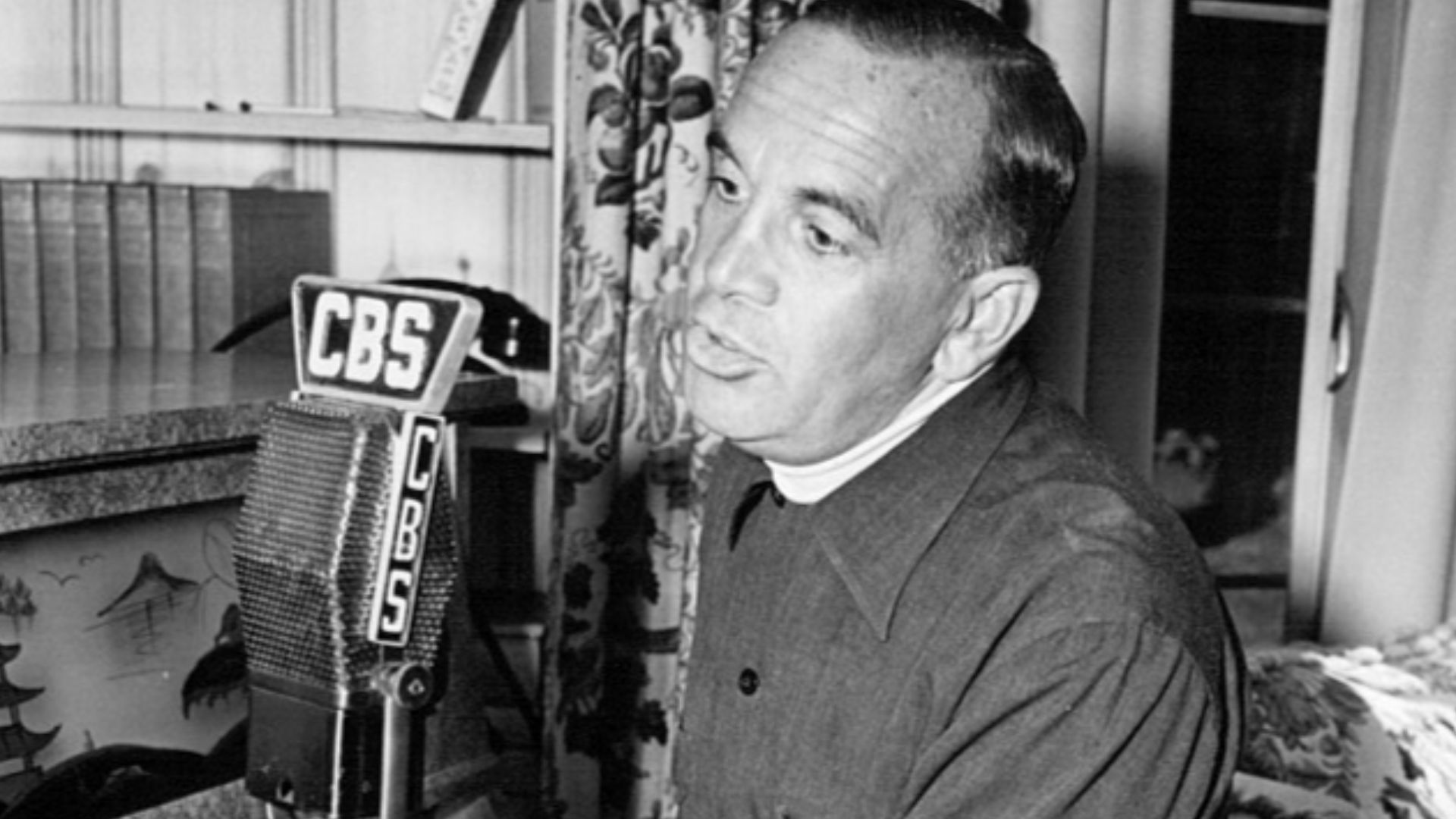Photo of Al Jolson at home singing on his radio program.