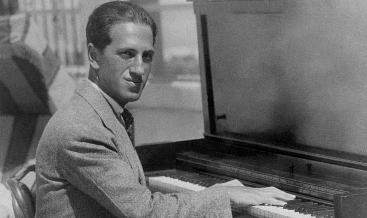 (Original Caption) Miami Beach, Florida: George Gershwin famous composer who couldn't leave his piano behind even when he went on vacation in this city. He comprised by having a piano placed on the roof of his hotel here, where he can enjoy his playing and the sunshine at the same time.