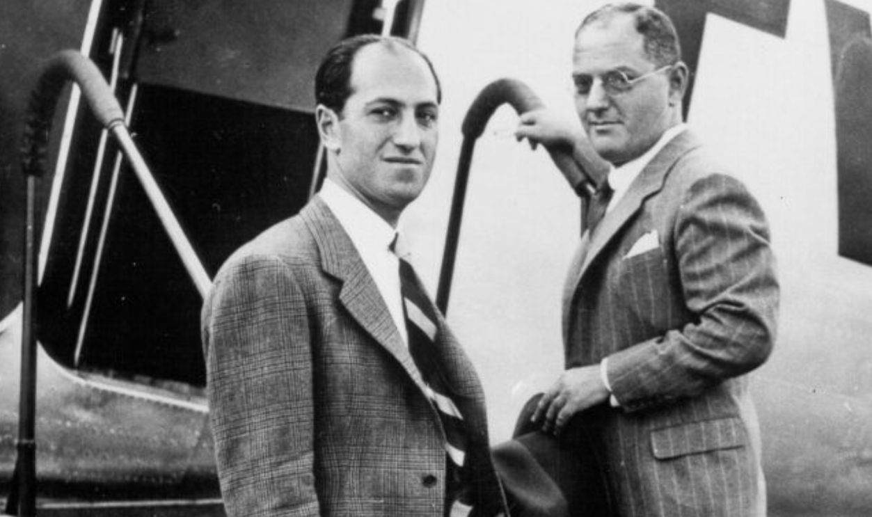 NEWARK, NJ - AUGUST 10: Composers George Gershwin & Ira Gershwin pose for a portrait as they board a TWA plane bound for Hollywood at Newark Airport on August 10, 1936 in Newark, New Jersey. 