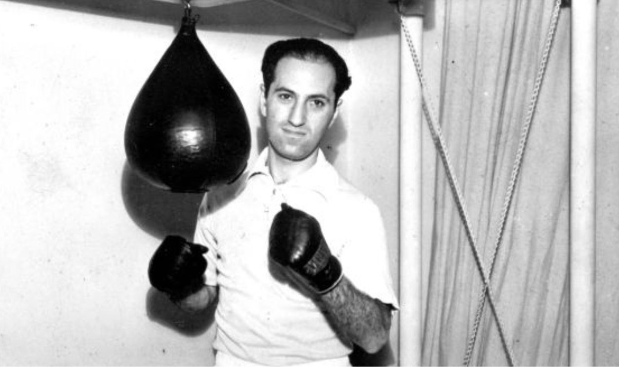 Portrait of American composer and musician George Gershwin (1898 - 1937) as works out with a speedbag as part of his physical fitness routine, New York, New York, 1933. 