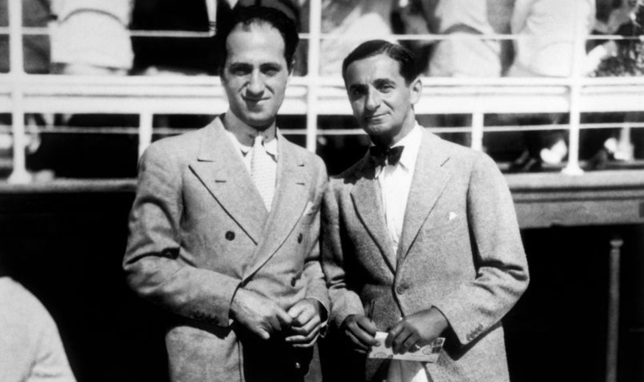 CIRCA 1935: Composers George Gershwin (left) and Irving Berlin (right) pose for a portrait circa 1935. 