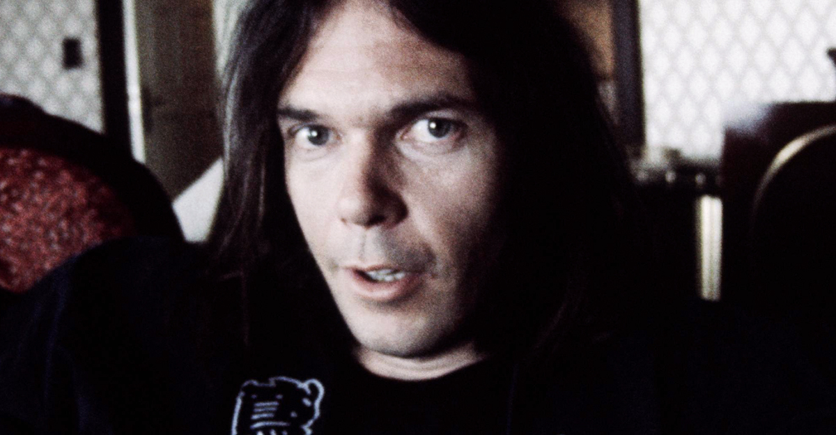 Neil Young in happi-coat relaxing at a hotel, Tokyo, March 1976. 
