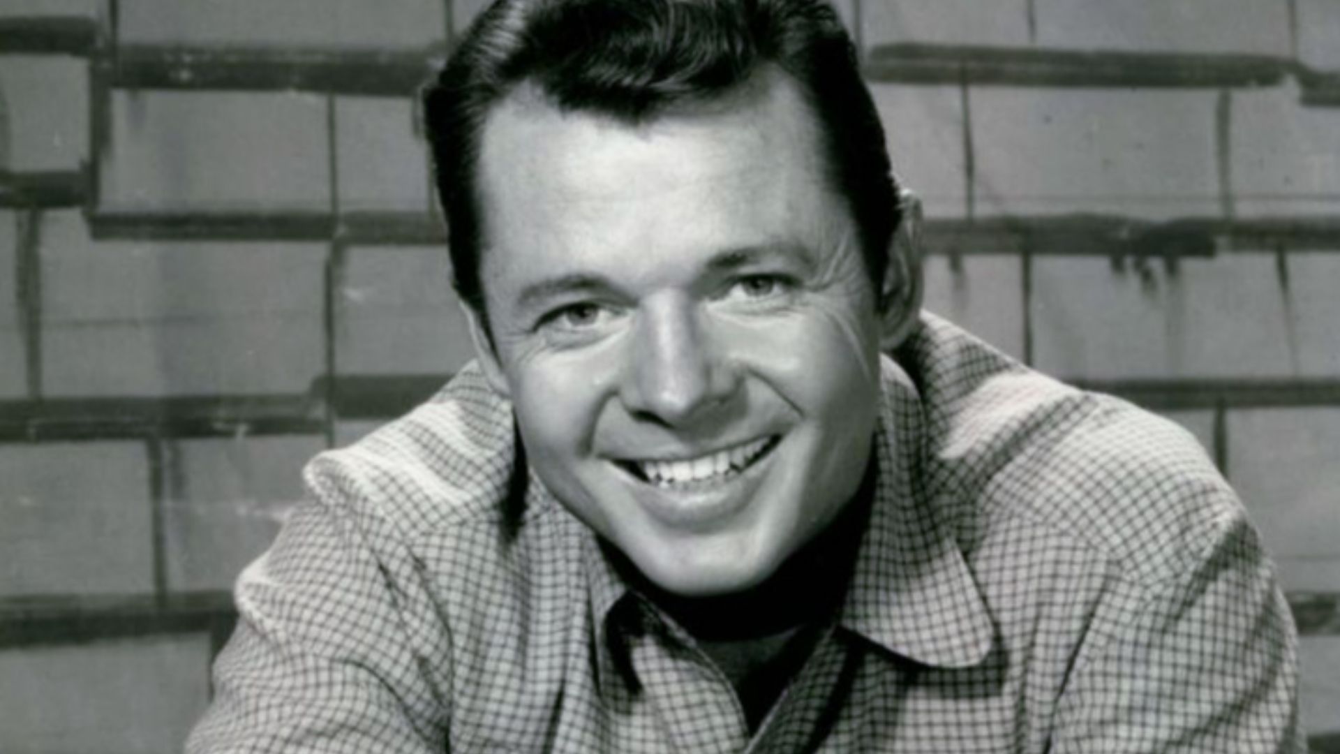 Photo of Audie Murphy as Tom Smith from the television program Whispering Smith.