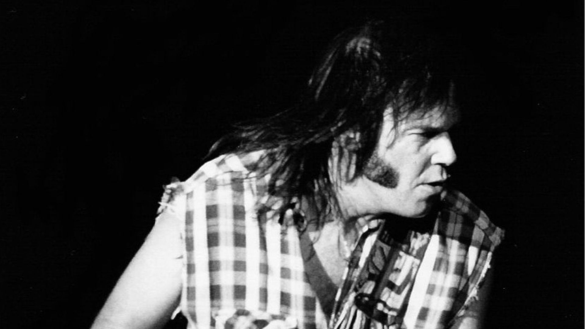 Neil Young performing with Crazy Horse in Barcelona