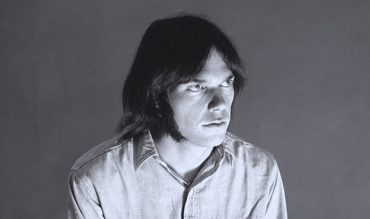 Gettyimages - 2189574633, Portrait Of Neil Young Portrait of American Folk, Pop, & Rock musician Neil Young, of the group Crosby, Stills, Nash, & Young, as he poses in a studio, September 18, 1969.