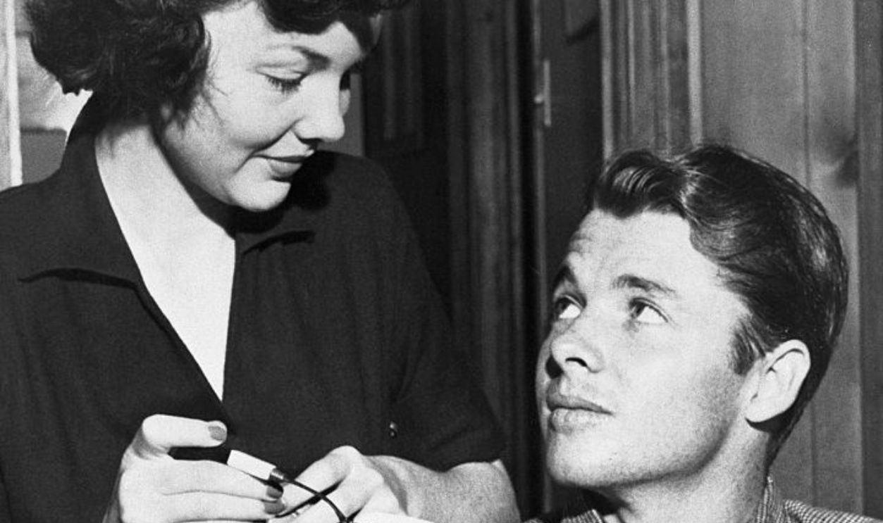 (Original Caption) War hero Audie Murphy and his actress wife, Wanda Hendrix, intend to try again to make their marriage work. Here, the couple, relaxing over morning coffee at their ranch, near Dallas, Texas, look forward to marital happiness.