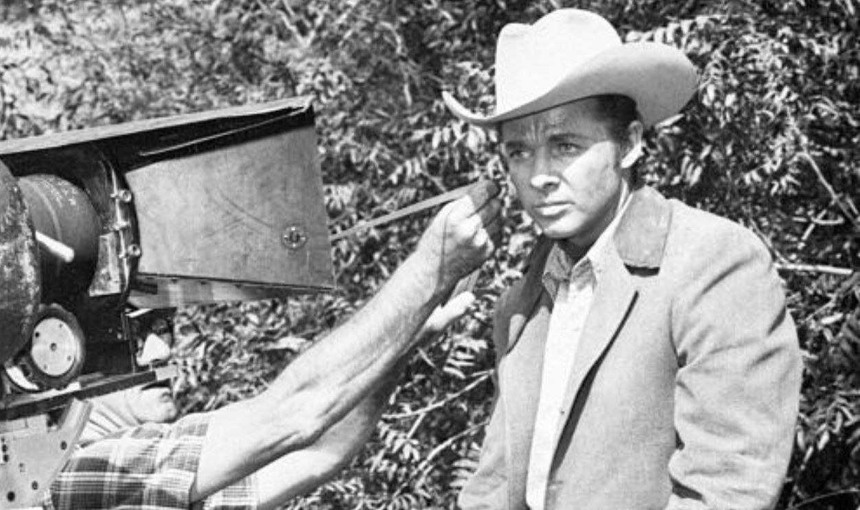 (Original Caption) 12/17/1959-Universal City, CA- No horse laughs, please, as you get this behind-the-scenes peek of Audie Murphy riding a stepladder instead of a mustang for a new movie western. An expert rider, Murphy had to switch to the ladder when his horse wouldn't hold still for a close-up shot of the actor in Universal-International's 