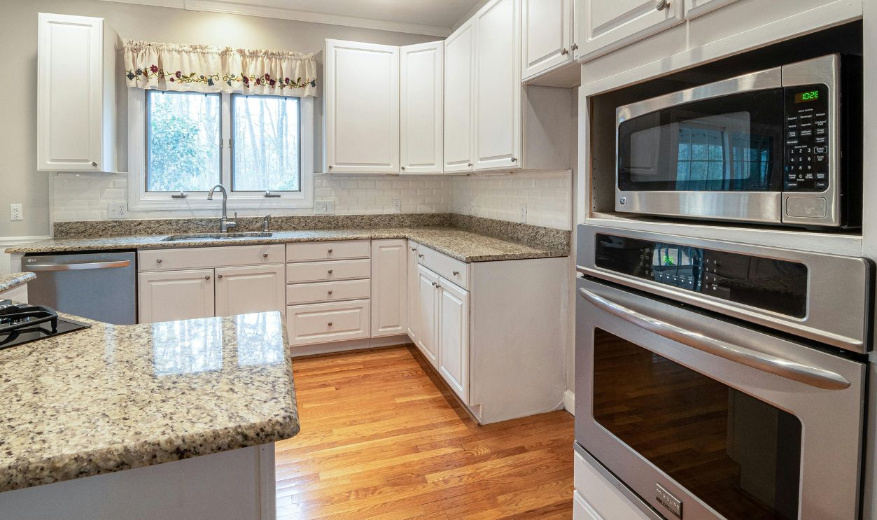 Photo Of Oven Near Marble Surface