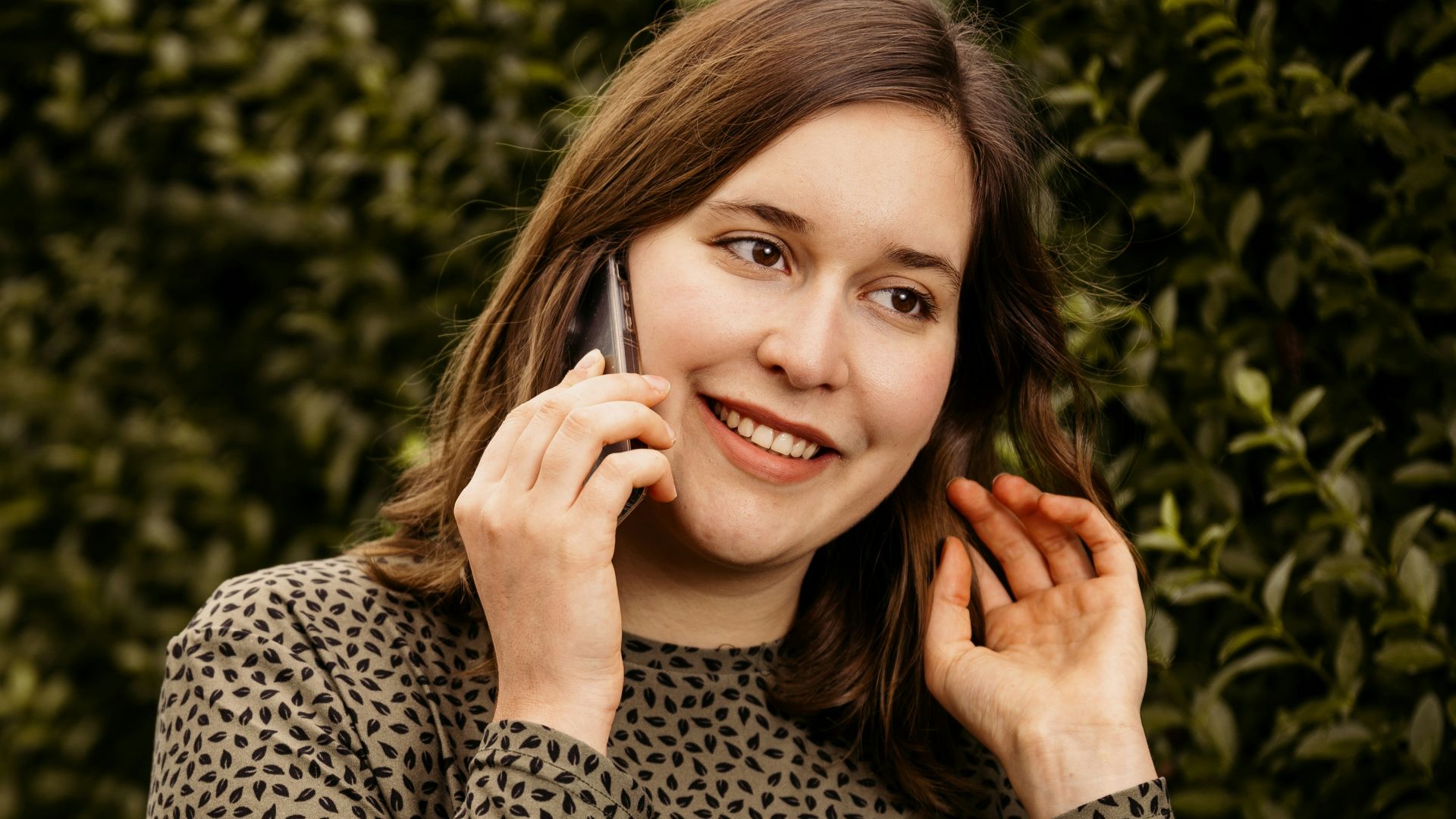 A young woman talking on a cell phone