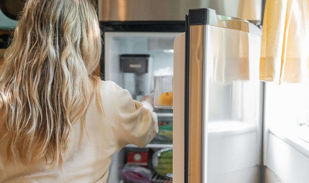 Woman Getting Some Foods in the Refrigerator