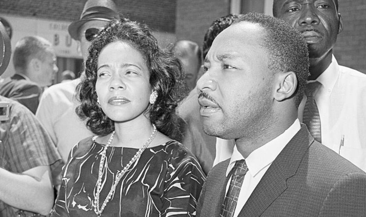 Dr. Martin Luther King, Jr. and his wife Coretta, stand outside a courtroom in Albany, Georgia where Dr. King was given a suspended sentence for his participation in a civil rights demonstration.