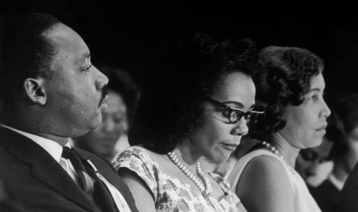 From left, American Civil Rights leaders and married couples, Dr Martin Luther King Jr (1929 - 1968) & Coretta Scott King (1927 - 2006) and Evelyn G Lowery (1925 - 2013) & Reverend Joseph Lowery (1921 - 2020), sit in the audience during an SCLC (Southern Christian Leadership Conference) event, Birmingham, Alabama, August 1965. 