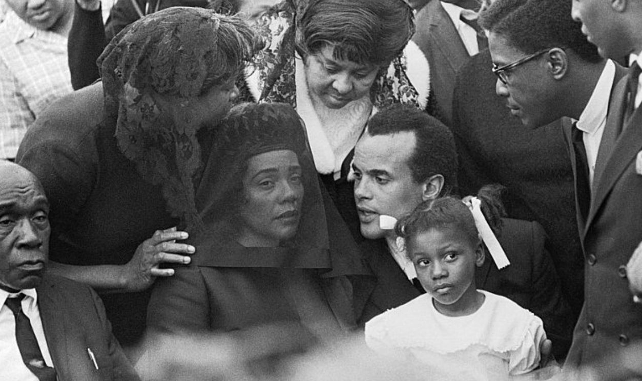 Dr. Martin Luther King Jr.'s wife Coretta Scott King and family are seen here during the funeral ceremonies for the slain Civil Rights Activist. Harry Belafonte sits beside Mrs King, who wears a veil.