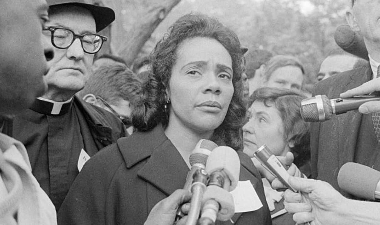African American civil rights leader Coretta Scott King (1927 - 2006), center left, with American pediatrician and activist Dr Benjamin Spock (1903 - 1998), right, are interviewed outside the White House during an anti-war protest by the Spring Mobilization Committee to End the War in Vietnam, Washington, DC, May 17, 1967. 