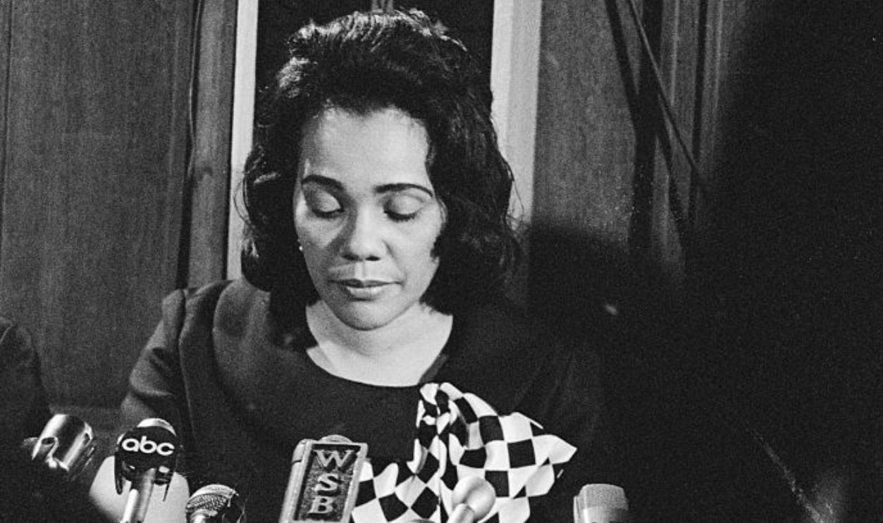 (Original Caption) Mrs. Martin Luther King Jr., reads a prepared statement, as she sit beneath the pulpit of her late husband's pastorate, the Ebenezer Baptist Church. Funeral services for the slain civil rights leader was held from the same church.