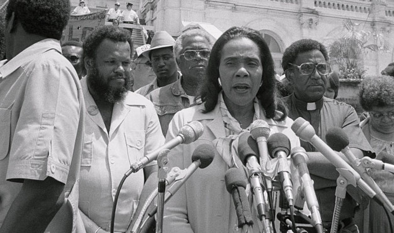 (Original Caption) Coretta King Speaks to a group of civil rights marchers on Capitol Hill 6/23 as Rev. Joseph Lowery, president of the Southern Christian Leadership Conference, (R) listens on. About 200 people attended the rally, half of whom marched to Washington from Alabama in support of the voting Rights Act, jobs and peace.