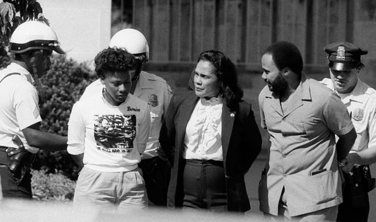 (Original Caption) 6/26/1985-Washington, DC: Coretta Scott King, widow of the late Martin Luther King, Jr., and children Bernice & Martin are arrested as they protest apartheid at the South African Embassy in D.C.