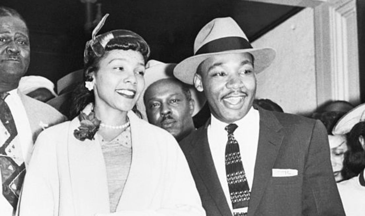(Original Caption) 3/23/1956-Montgomery, AL: Reverend Martin Luther King, Jr., 27, is shown with his wife as they emerge from court house following the conclusion of his trial on charges of conspiring to boycott segregated city buses. He was found guilty and ordered to pay $1,000 in fines and costs or serve 365 days at hard labor. King immediately appealed to the Alabama Circuit Court of Appeals and the execution of the sentence was held in Abeyance pending the appeal.