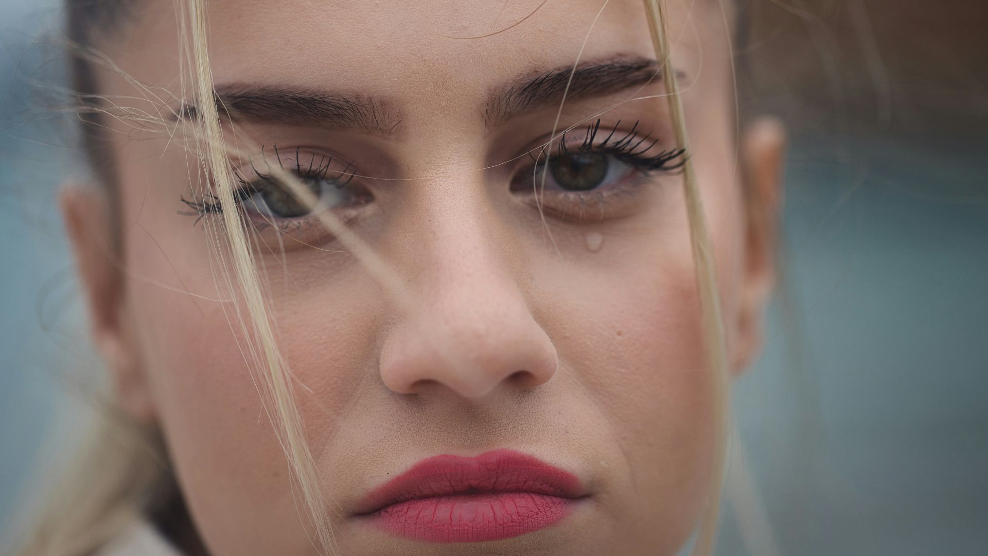 a close up of a person with long hair