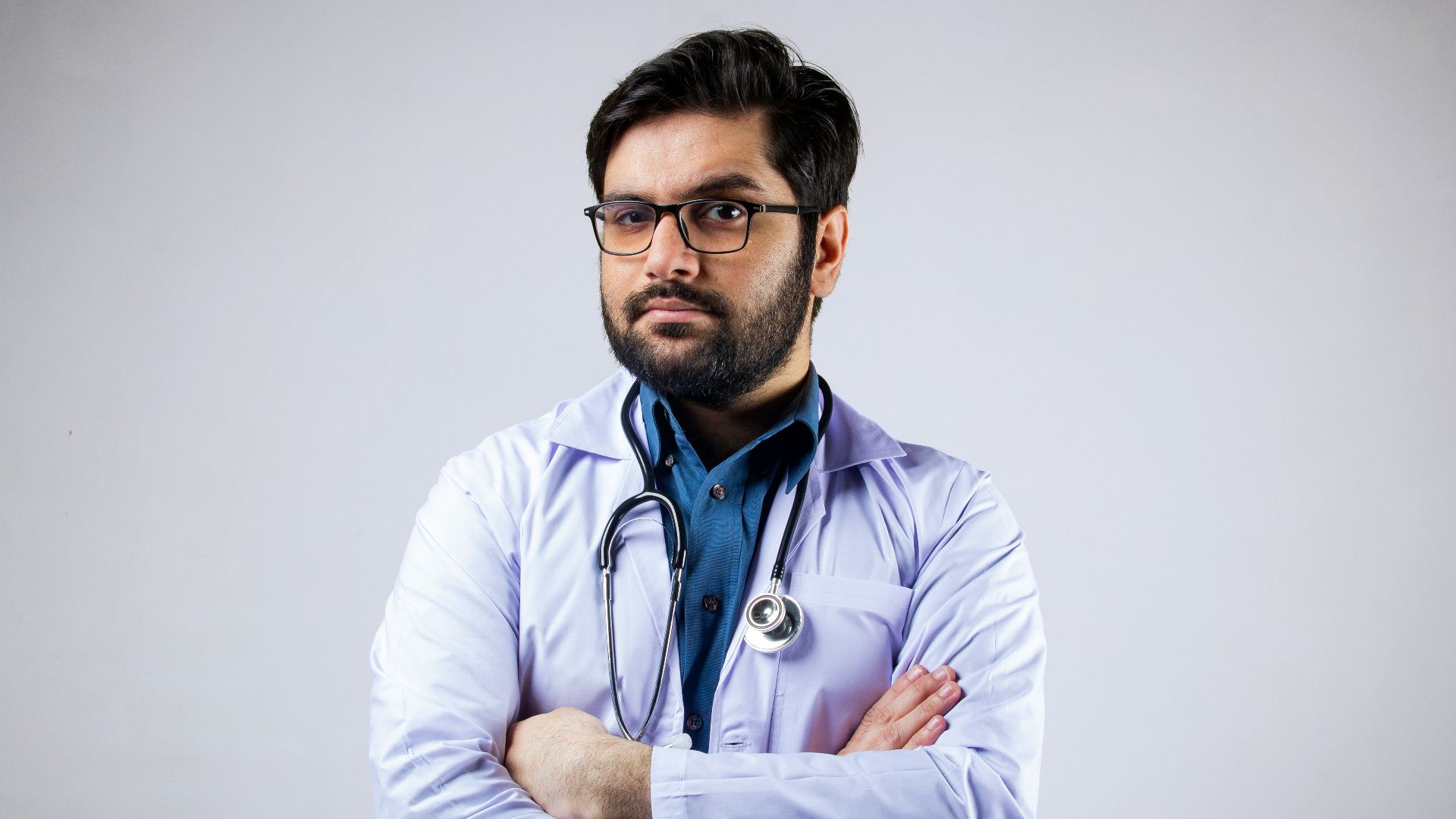 man in white dress shirt wearing black framed eyeglasses