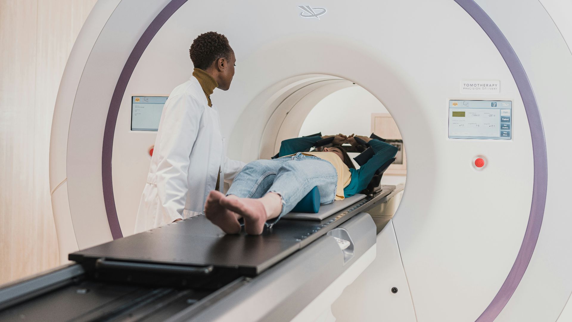 a man and a woman in a room with a computer