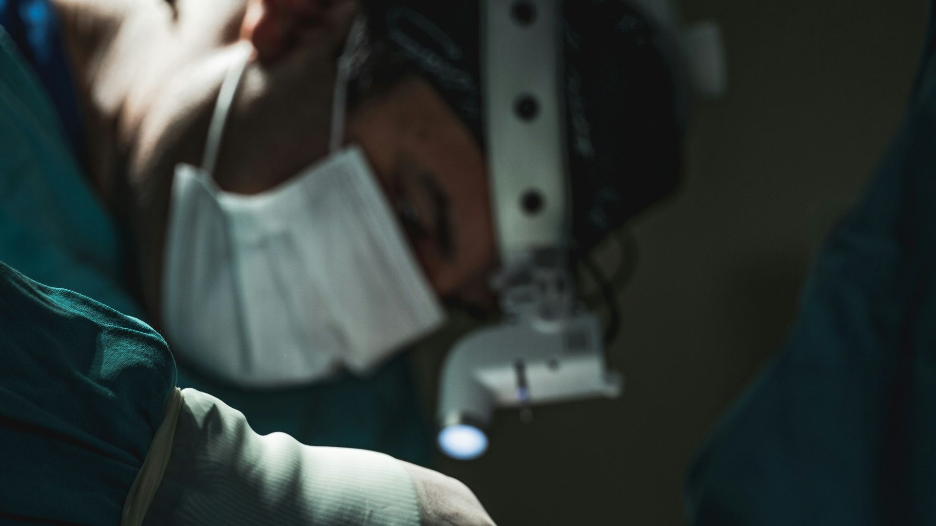 a person in a hospital bed with an iv