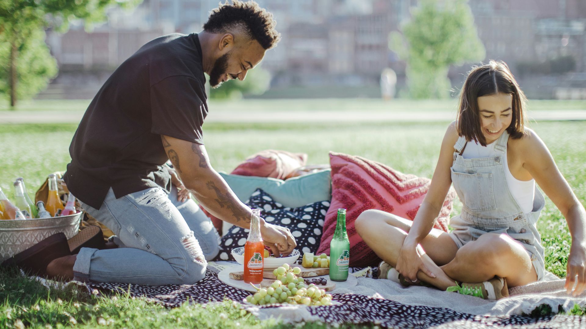 man in black t-shirt sitting on woman in white tank top and man in black
