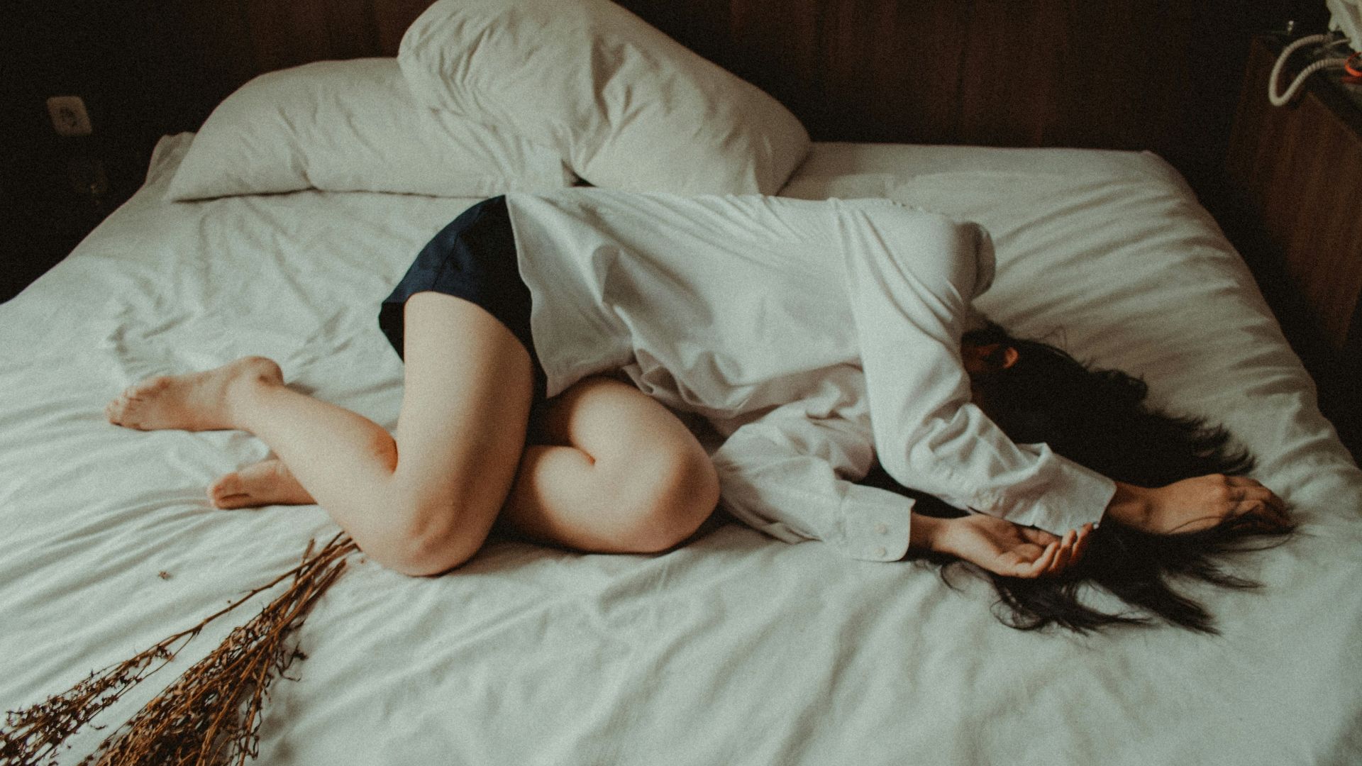 woman lying on bed