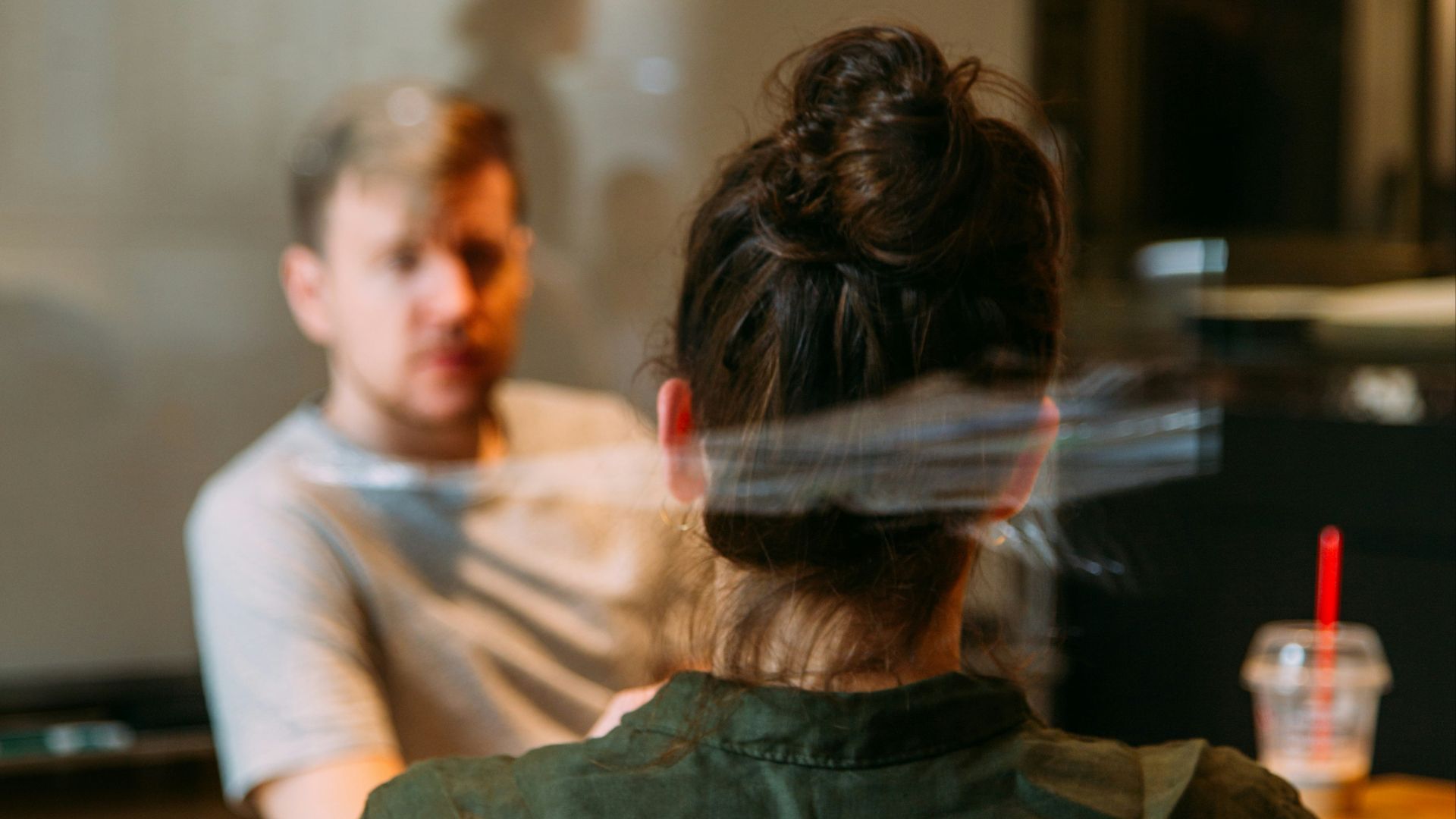 person sitting in a chair in front of a man