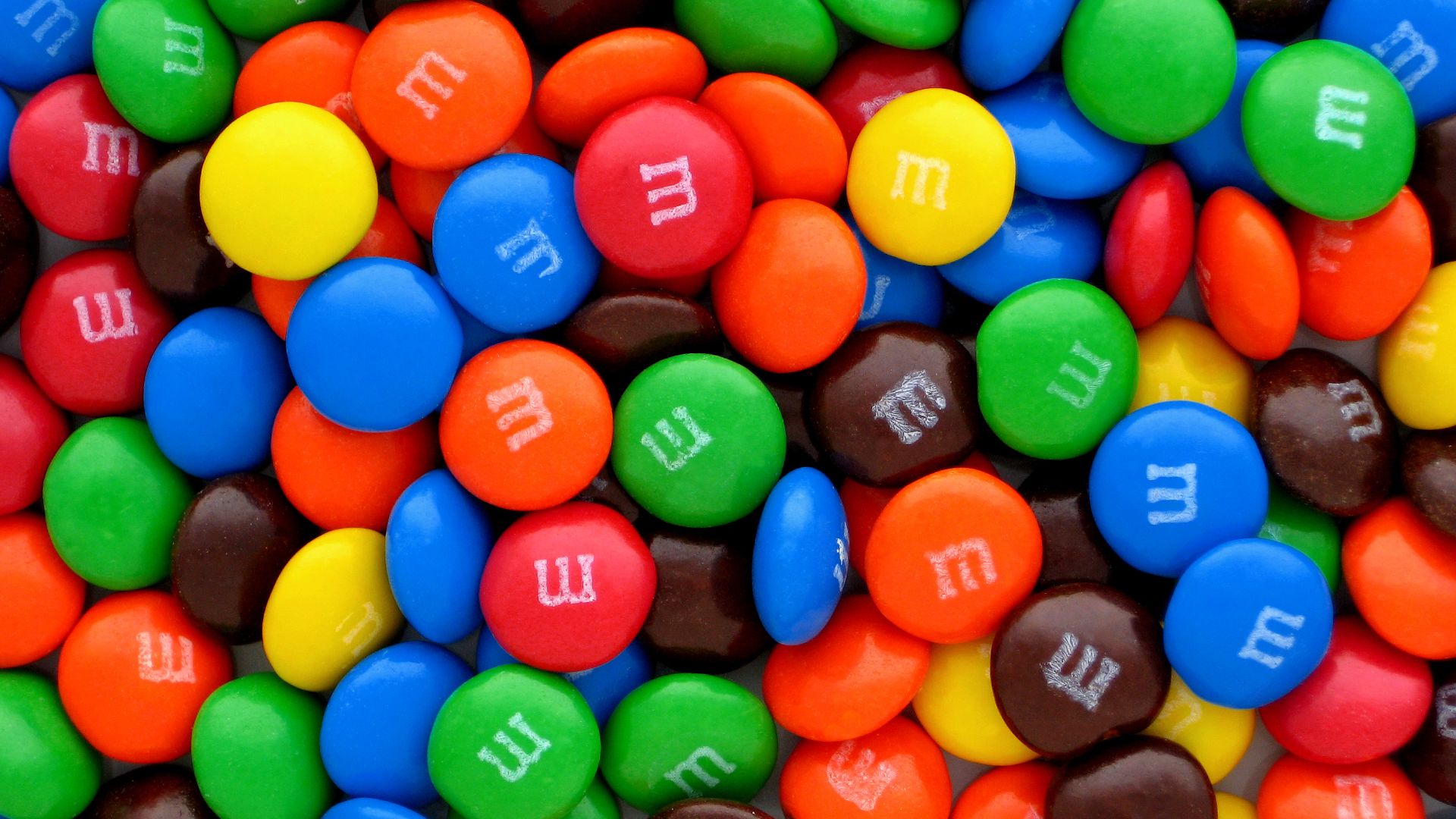 A pile of plain M&M's candies.