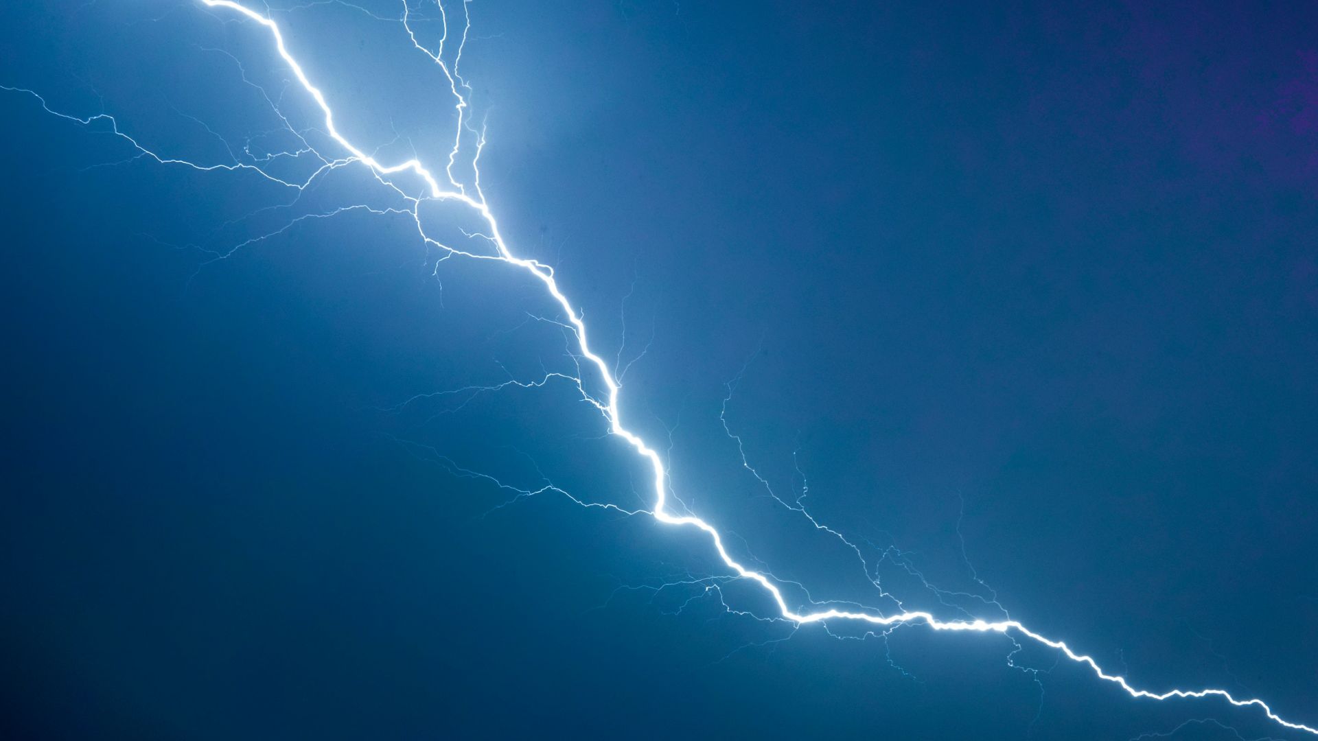 a lightning bolt is seen in the sky