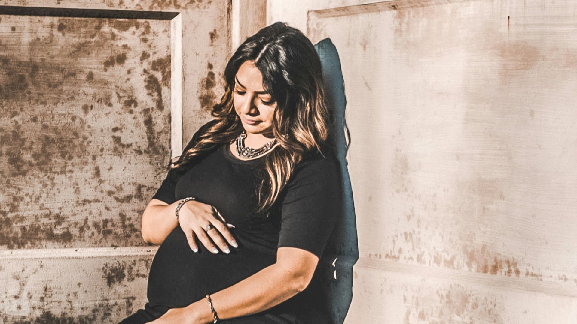 woman sitting on concrete pavemen