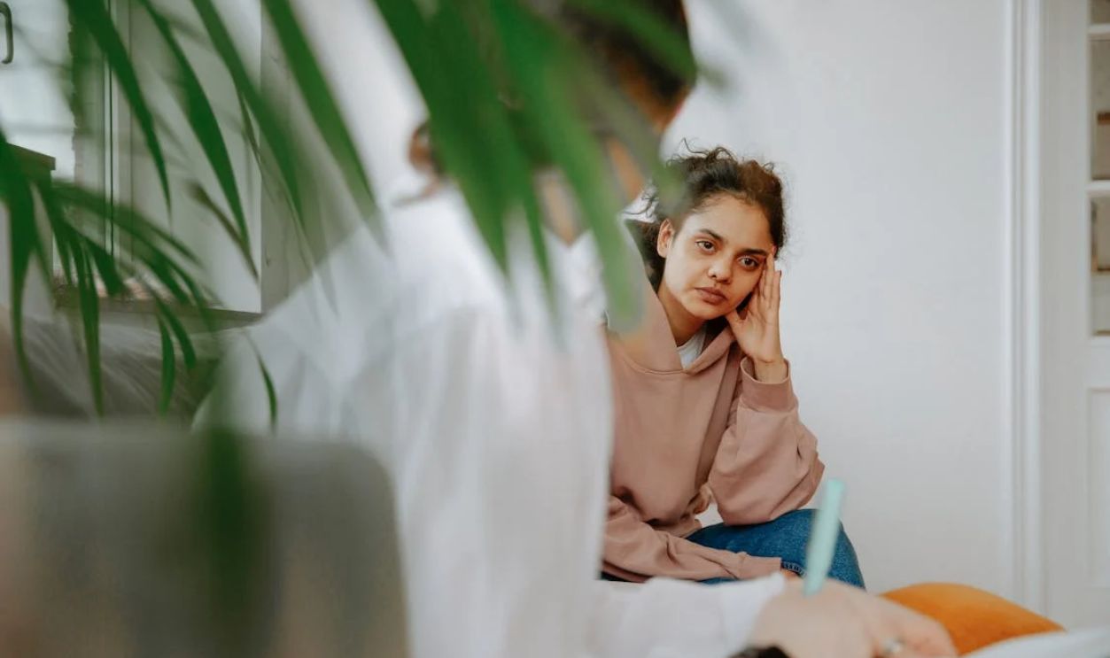 Woman Listening to Therapist