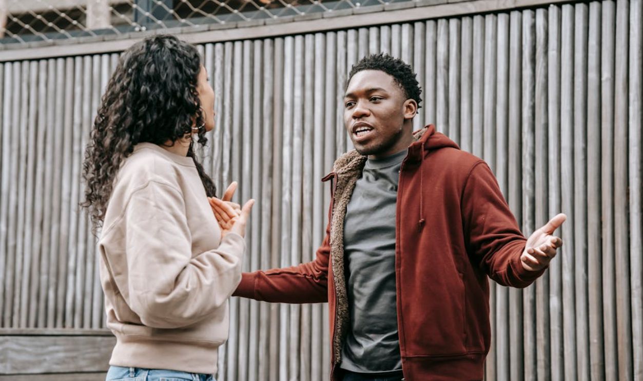 Multiethnic couple scolding on street