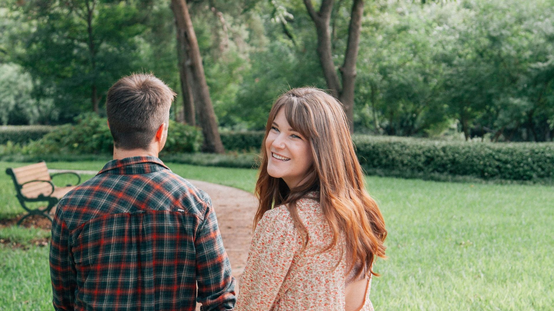 man and woman standing on pathway during daytime