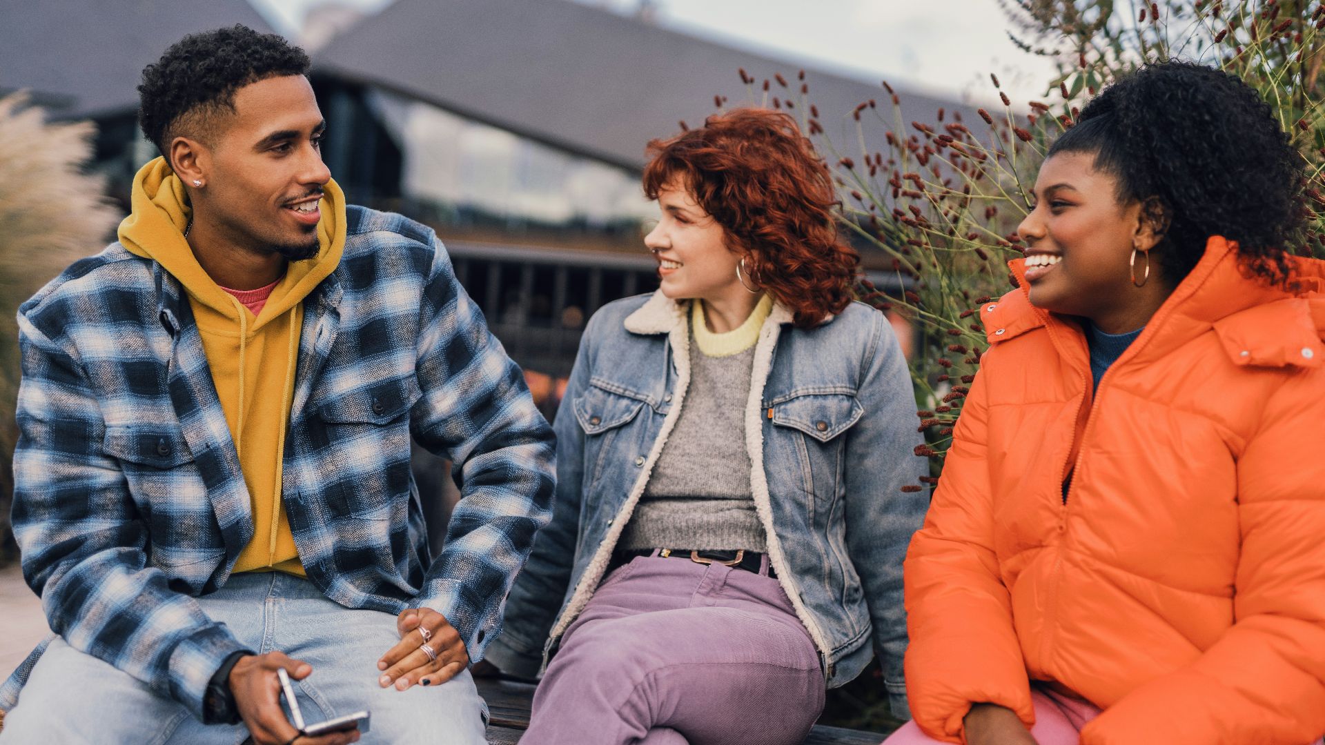 a group of people sitting outside
