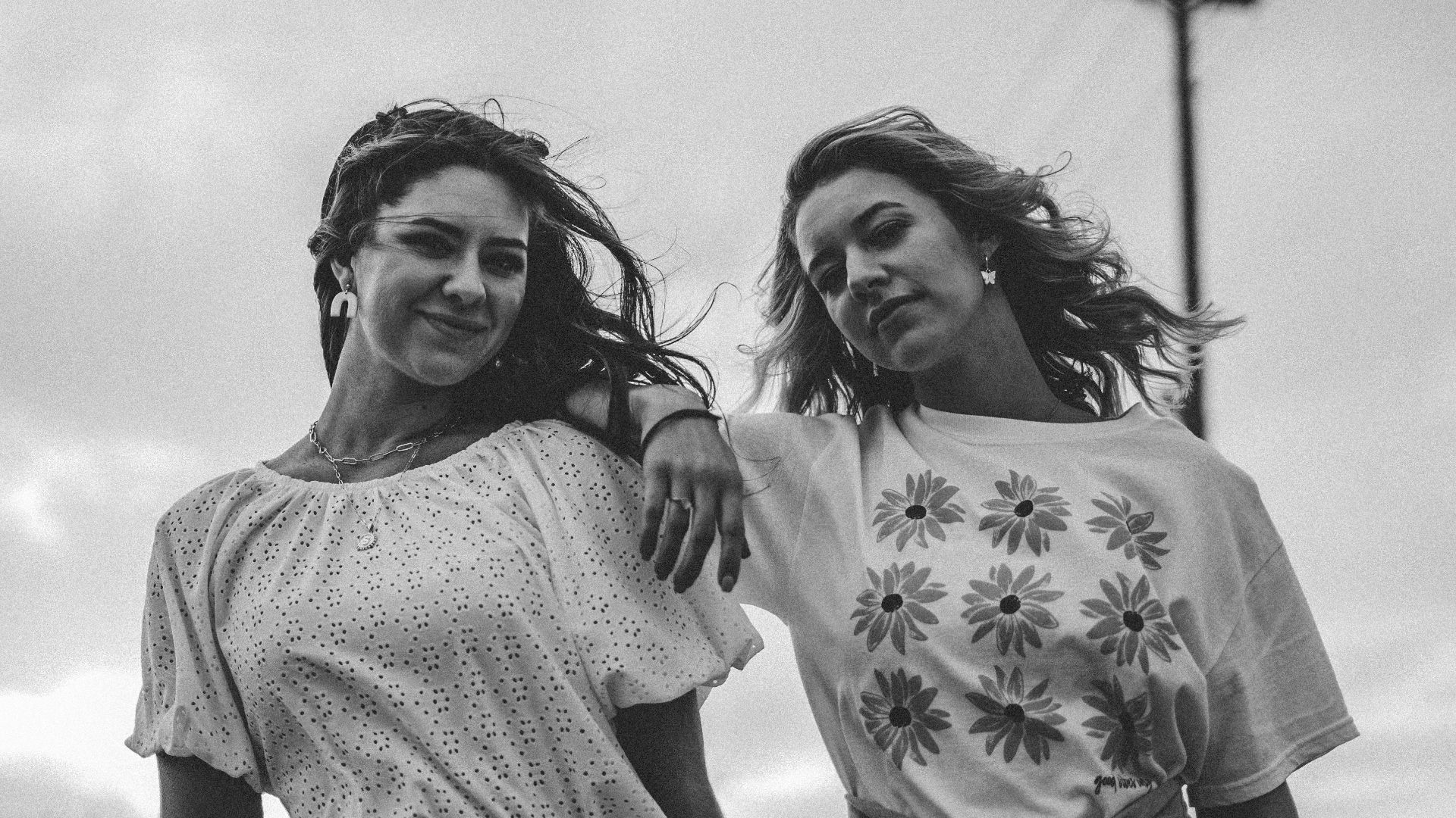 grayscale photo of 2 women smiling