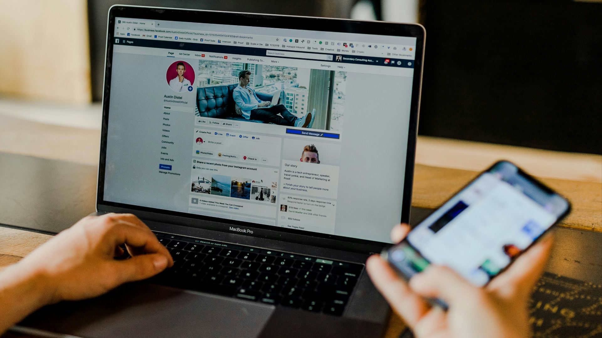 person using both laptop and smartphone