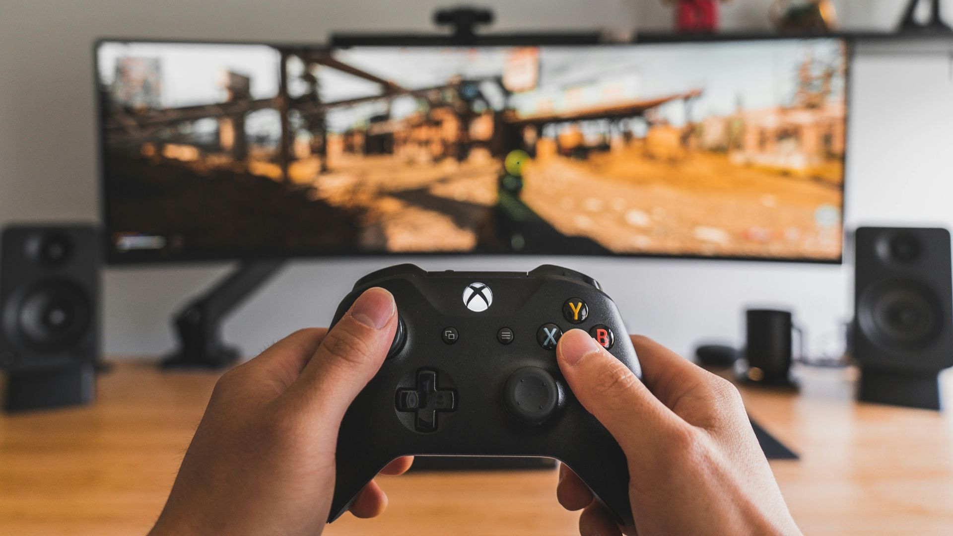 person holding black game controller