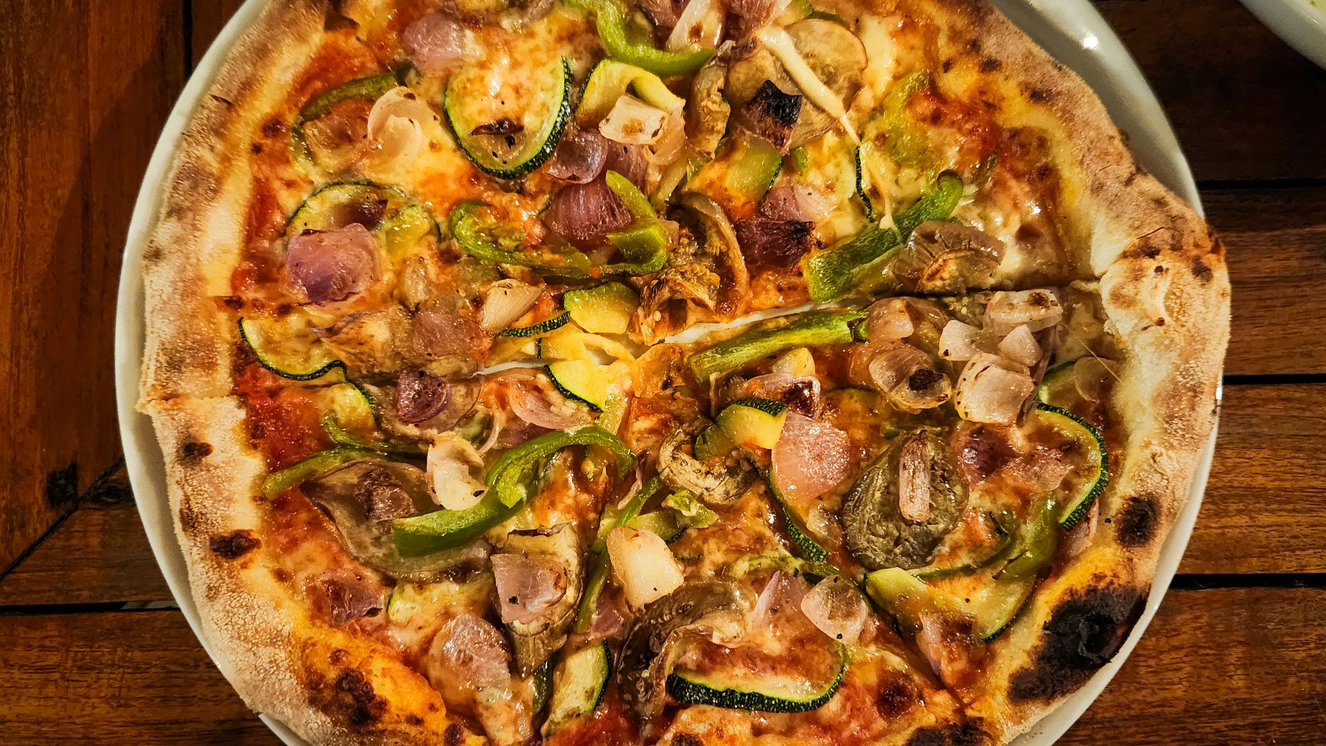 Delicious pizza with vegetables, ready to eat.