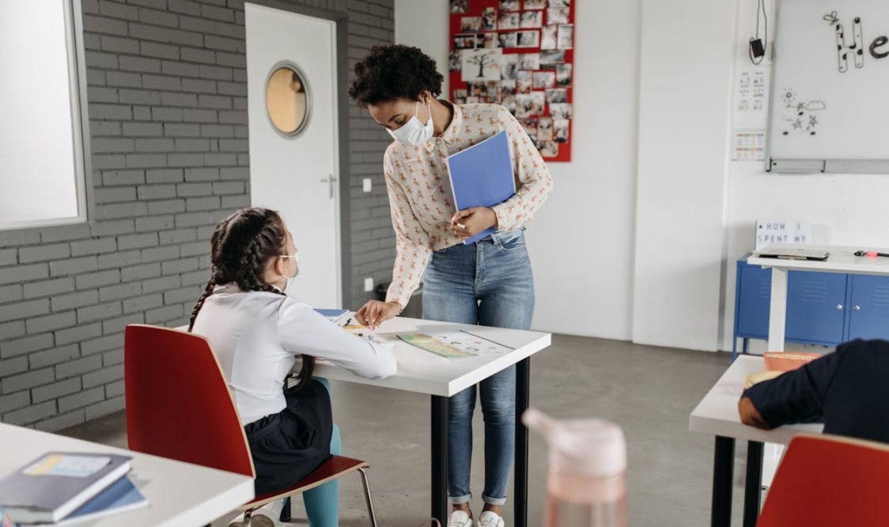 A Girl Sitting at the Table