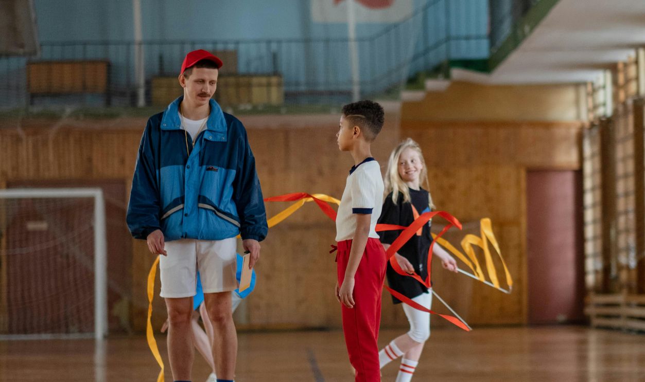 A Man Physical Education Teacher Coaching His Students