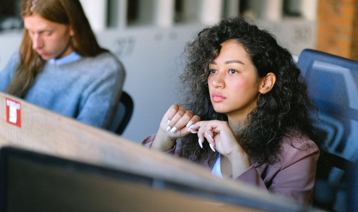 Focused woman thinking on problem in office