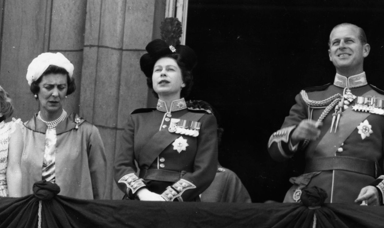 13th June 1959: L to r, the Duchess of Kent (1906 - 1968), Queen Elizabeth II, Prince Philip and Princess Margaret (1930 - 2002) watching an RAF fly past from Buckingham Palace balcony after the ceremony of Trooping the Colour. 