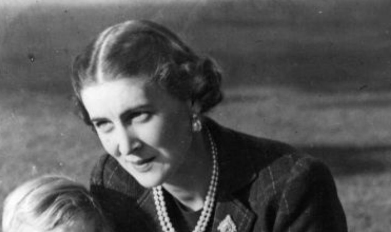 November 1937: The Duchess Marina of Kent (1906 - 1968), sitting on a rug on the lawn with her two children, Prince Edward and Princess Alexandra at 'Coppins' in Iver, Buckinghamshire.