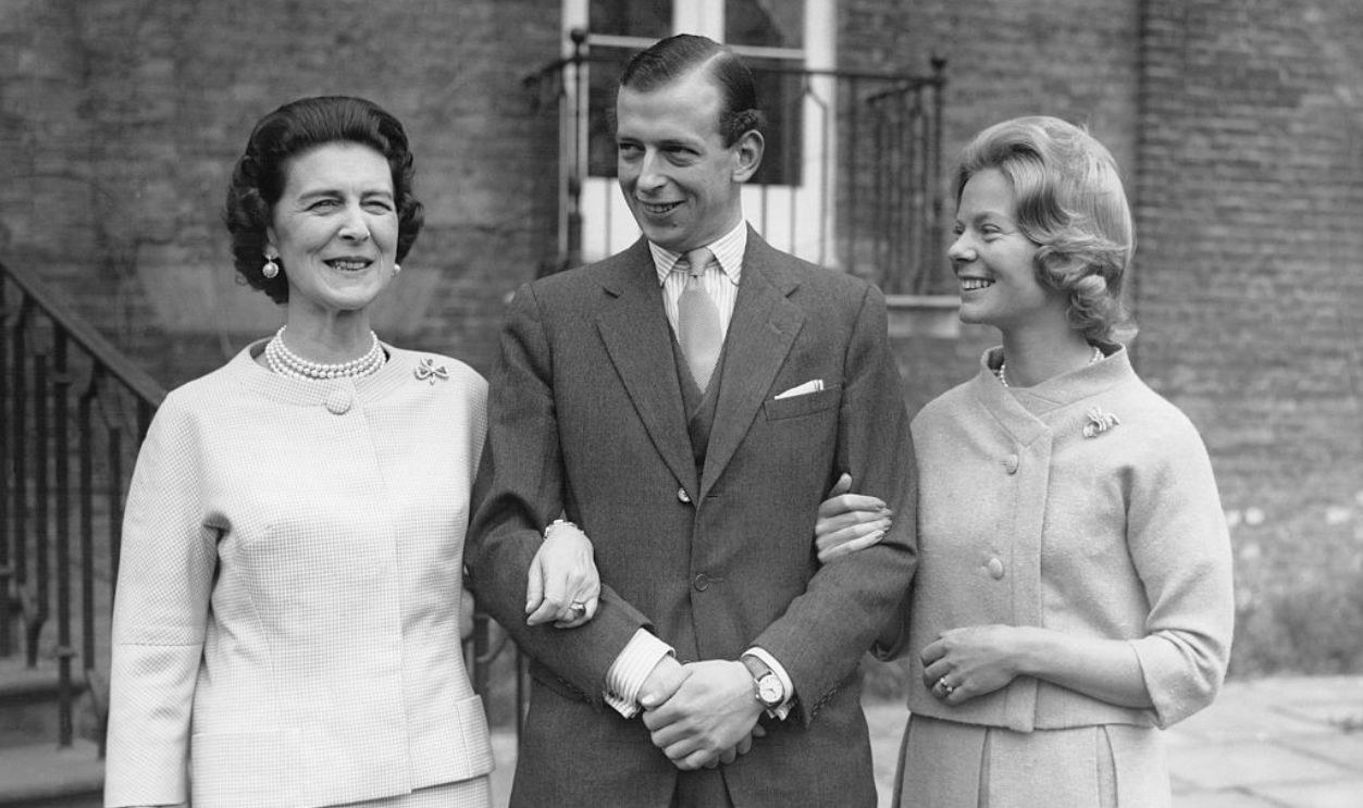 Duchess Marina of Kent arm in arm with her son, Prince Edward of Kent and his fiancée Miss Katharine Worsley in front of the steps of Kensington's Palace where the Duchess resides on March 9, 1961 in London, United Kingdom.